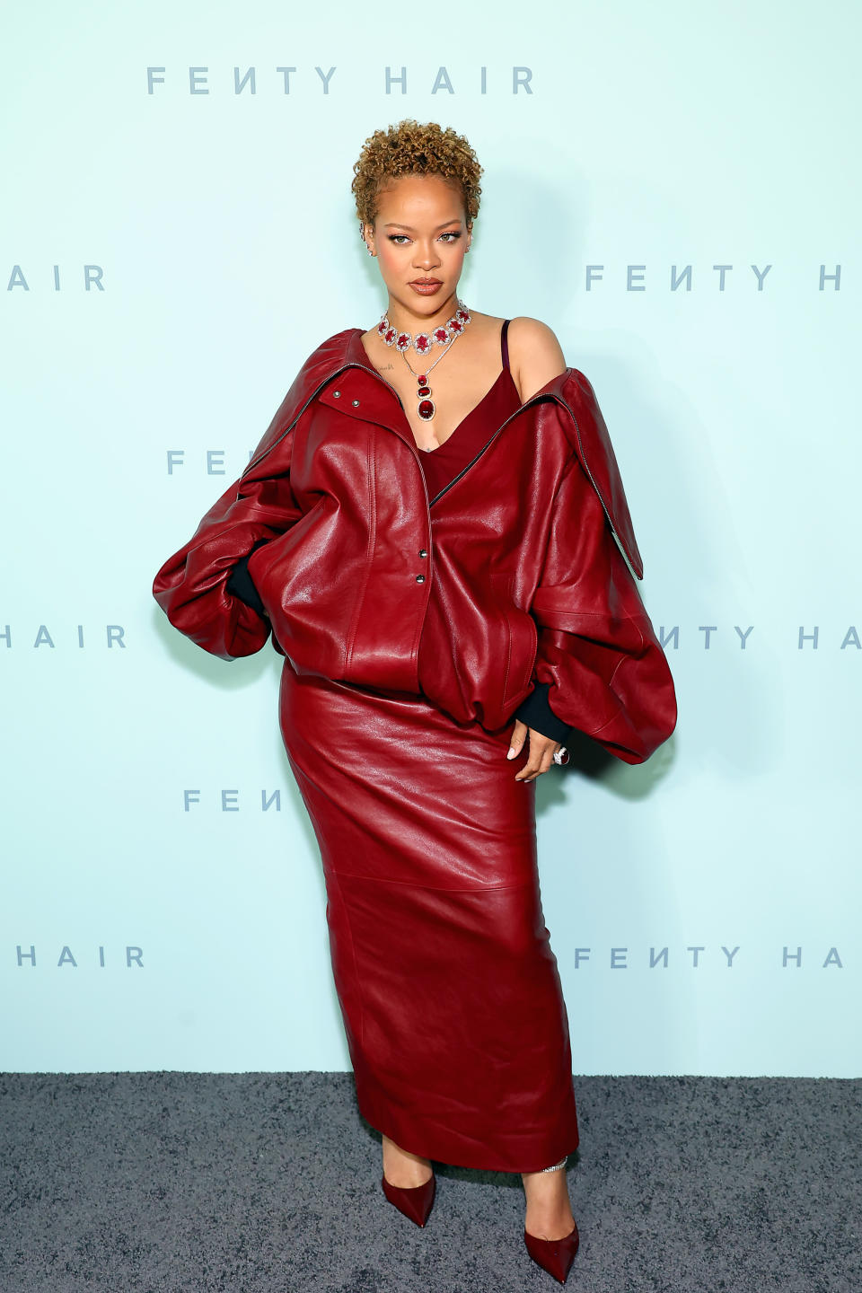 Rihanna wore an all-leather crimson red look by Khaite for her Rihanna x Fenty Hair Los Angeles Launch Party at Nya Studios on June 10. (Photo by Leon Bennett/Getty Images)