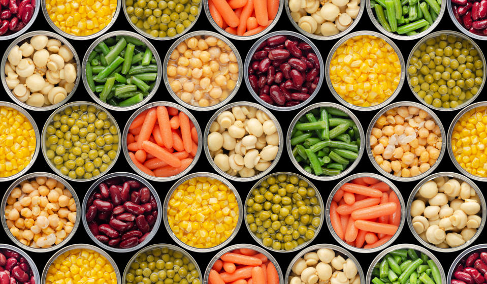 Seamless food background made of opened canned food. Dietitian Sharp says canned vegetables and legumes are a great source of nutrition. (via Getty)