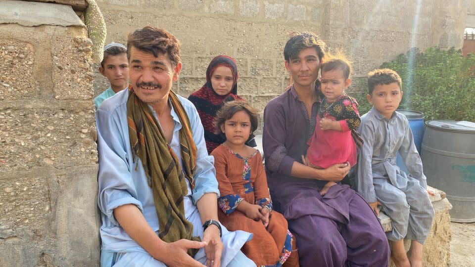 Amanullah (left) was six years old when his Afghan family sought refuge in Pakistan in the 1980s. He’s been living there for decades and now has a family of his own. - Javed Iqbal/CNN