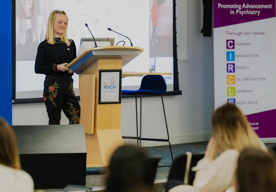 Emily Hale giving a speech at the Royal College of Psychiatry for the National Eating Disorder Conference. (Supplied)