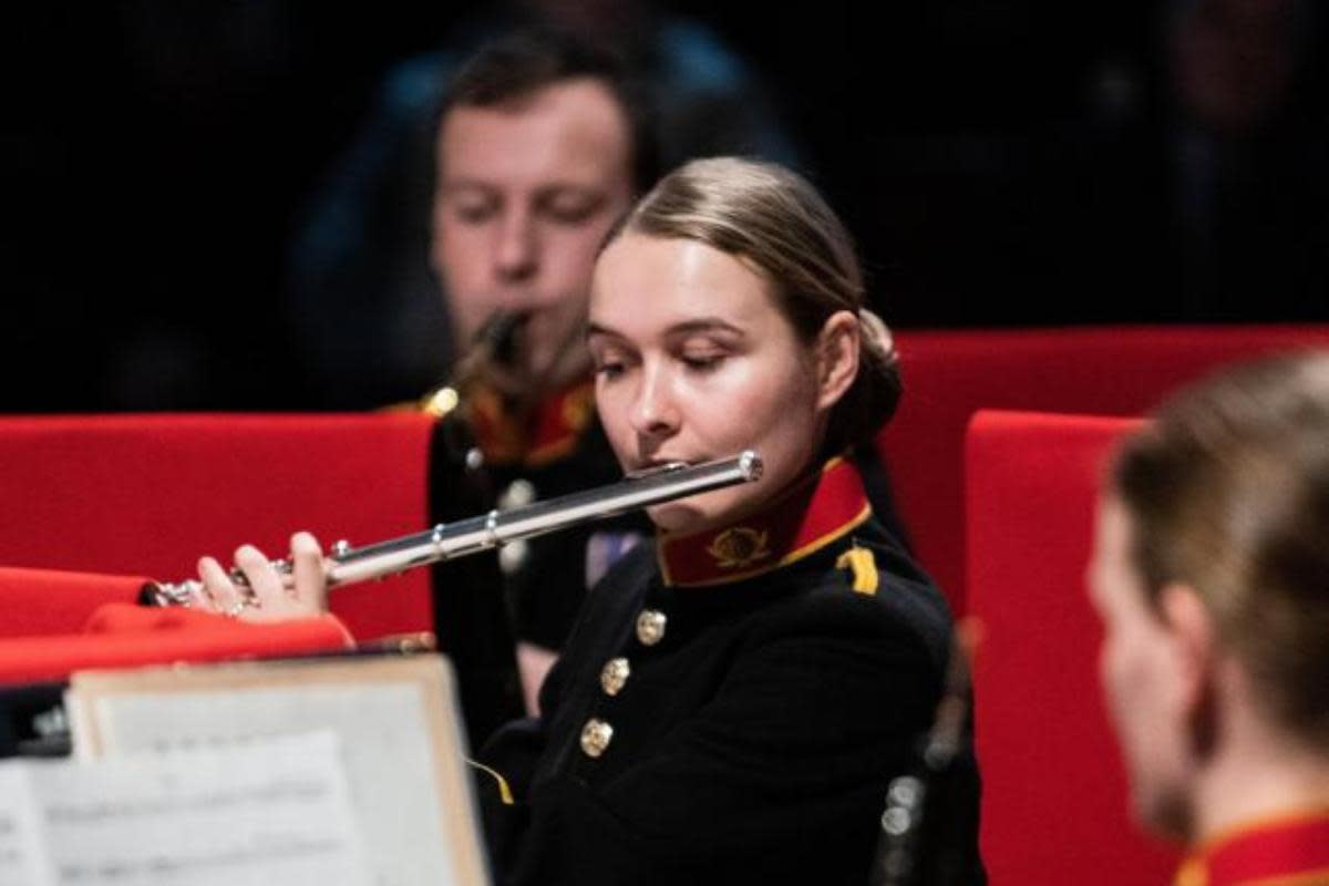 Sophie Ward playing the flute with the Band of the Royal Marines at Collingwood <i>(Image: Royal Marines)</i>