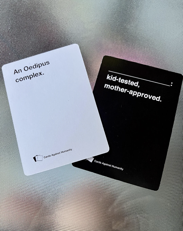 Two Cards Against Humanity cards: one white card reads "An Oedipus complex." and one black card reads "kid-tested, mother-approved."