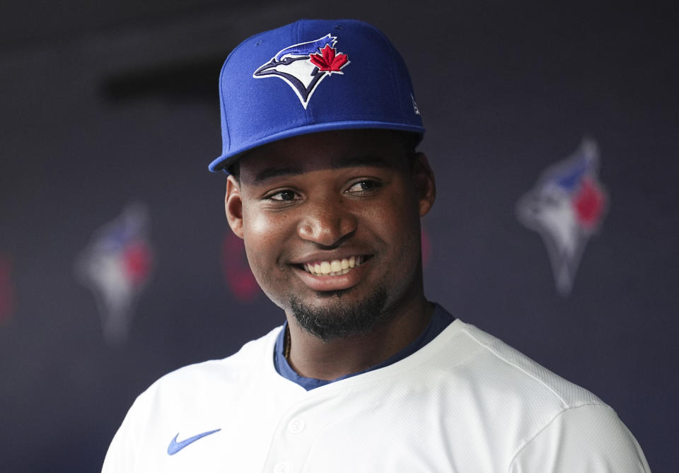 TORONTO, ON - JUNE 18: Orelvis Martinez #13 of the Toronto Blue Jays smiles from the dugout after being called up to the team from the minor leagues ahead of playing against the Boston Red Sox in their MLB game at the Rogers Centre on June 18, 2024 in Toronto, Ontario, Canada. (Photo by Mark Blinch/Getty Images)
