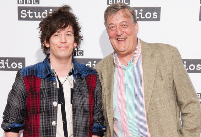 <p>Jeff Spicer/Getty</p> Elliott Spencer and Stephen Fry in 2017