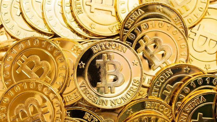 Bitcoin cryptocurrency background. A bunch of golden bitcoin, Digital currency