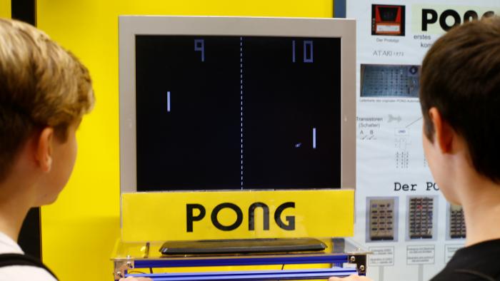 People play Atari arcade game "Pong" at the computer games fair Gamescom in Cologne, Germany, August 22, 2018. REUTERS/Wolfgang Rattay