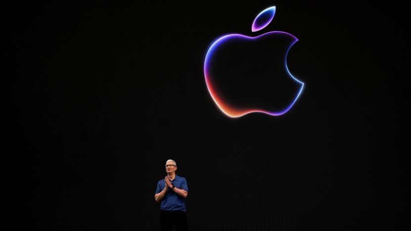 FILE PHOTO: Apple CEO Tim Cook attends the annual developer conference event at the company's headquarters in Cupertino, California, U.S., June 10, 2024. REUTERS/Carlos Barria/File Photo