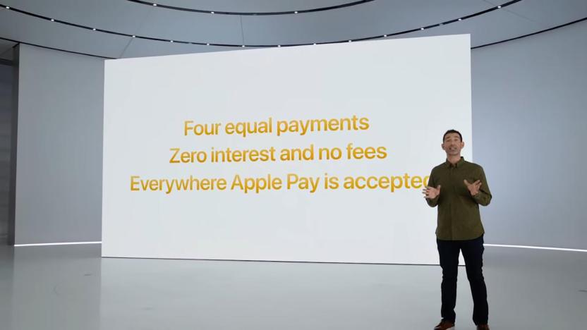 An Apple executive standing in front of a virtual screen with details about Apple Pay Later: "Four equal payments. Zero interest and no fees. Everywhere Apple Pay is accepted."
