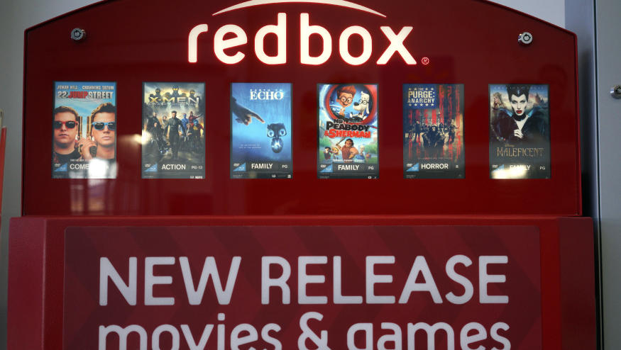 A Redbox video rental machine is seen at a Walmart in Broomfield, Colorado November 24, 2014. Outerwall Inc hiked prices for renting movies and video games at its Redbox kiosks to help fund improvements in its business as streaming sites reduce demand for DVDs. The cost of renting a DVD will increase to $1.50 per day from $1.20, while rental rates for Blu-ray discs will rise to $2 from $1.50, starting Dec. 2. The daily rental rate for video games will go up to $3 from $2 from Jan. 6.  REUTERS/Rick Wilking (UNITED STATES - Tags: SOCIETY BUSINESS ENTERTAINMENT)