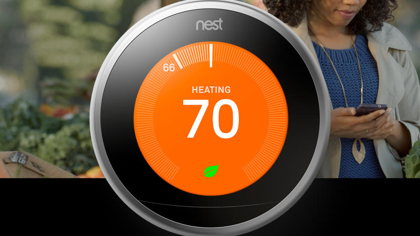 Google promo image for its Nest Learning Thermostat. Foreground: the circular device with a round screen (orange, reading "heating - 70"), a black border and a steel dial. Background: a person looking at their phone while out in a park.