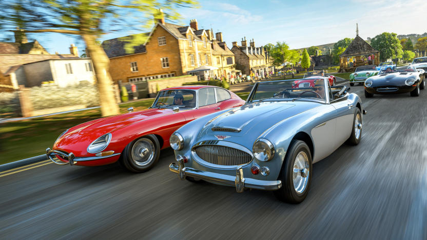 Classic cars race each other in a British town