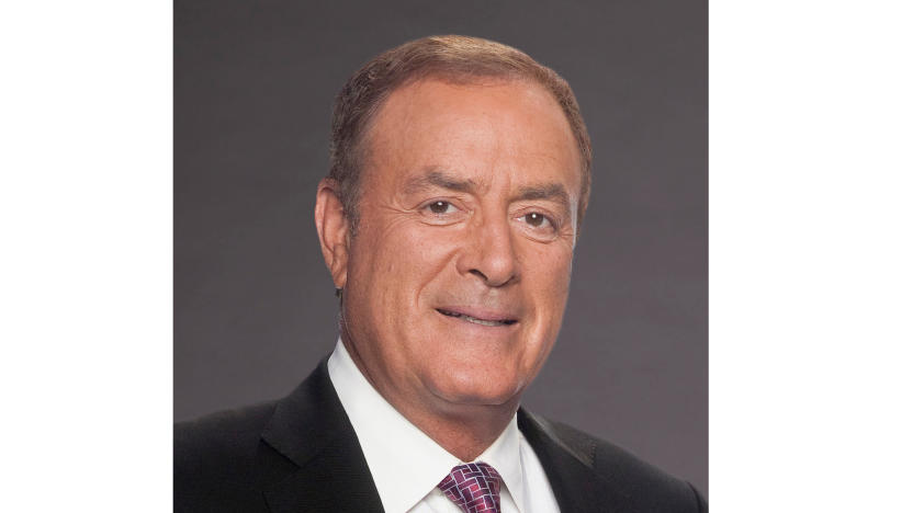 Headshot of broadcaster Al Michaels. Smiling into the camera with a gray background.