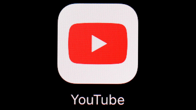 FILE - The YouTube app is displayed on an iPad in Baltimore. Police said Wednesday, Jan. 31, 2024, that they charged Justin Mohn, 32, with first-degree murder and abusing a corpse after he beheaded his father, Michael, in their Bucks County, Pa., home and publicized it in a 14-minute YouTube video that anyone, anywhere could see. (AP Photo/Patrick Semansky, File)
