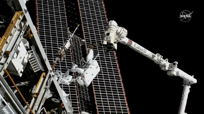 Astronauts conduct a spacewalk to replace a faulty antenna on the International Space Station (ISS) in a still image from video December 2, 2021.  NASA TV/Handout via REUTERS THIS IMAGE HAS BEEN SUPPLIED BY A THIRD PARTY.