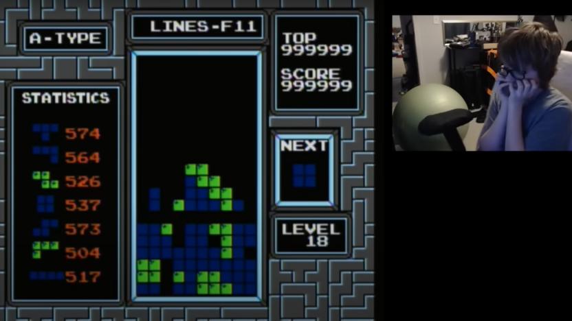 A young boy looks on as Tetris hits a kill screen.