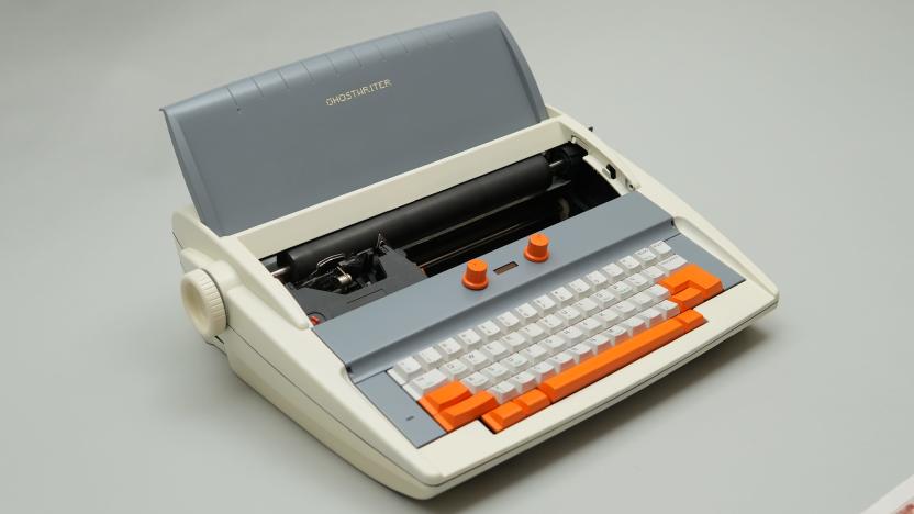 A beige Brother typewriter with orange accents restomodded to run ChatGPT on a grey background