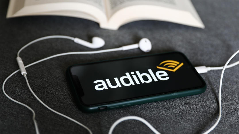 Audible logo displayed on a phone, headphones and a book are seen in this illustration photo taken in Krakow, Poland on August 22, 2022. (Photo by Jakub Porzycki/NurPhoto via Getty Images)
