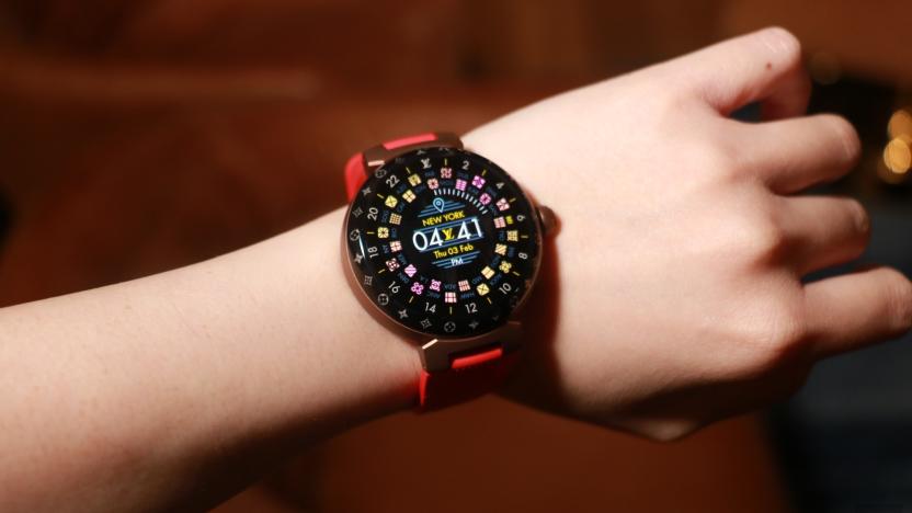 The Louis Vuitton Tambour Horizon Light Up smartwatch with a red rubber strap on a wrist. 