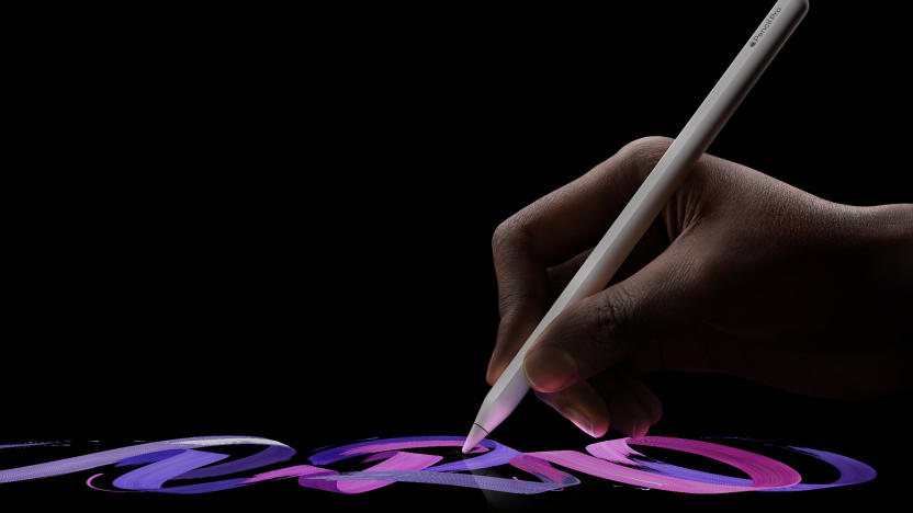 A hand draws on an iPad with the Apple Pencil Pro