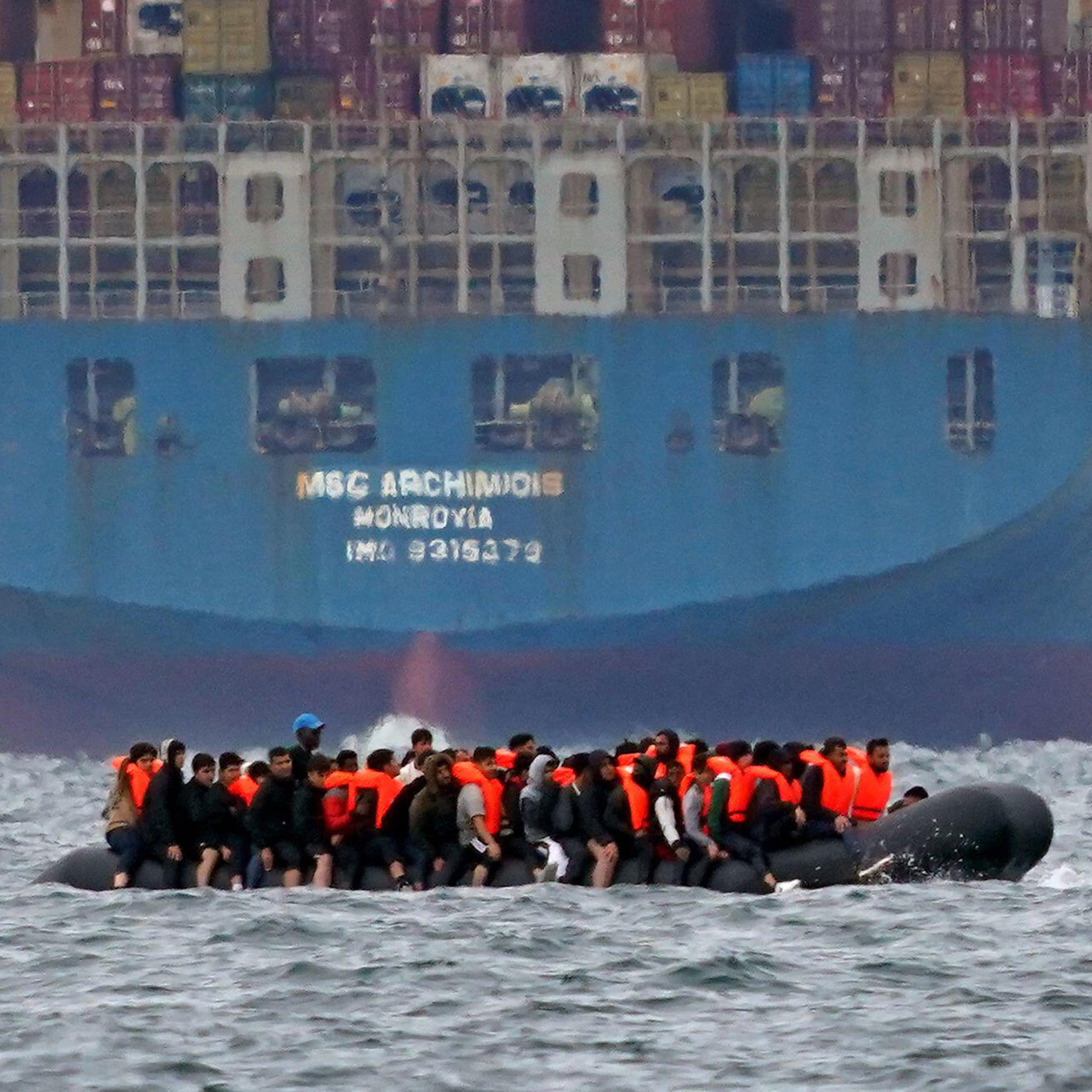 A small boat carrying what is thought to migrants near a tanker in the English Channel. 