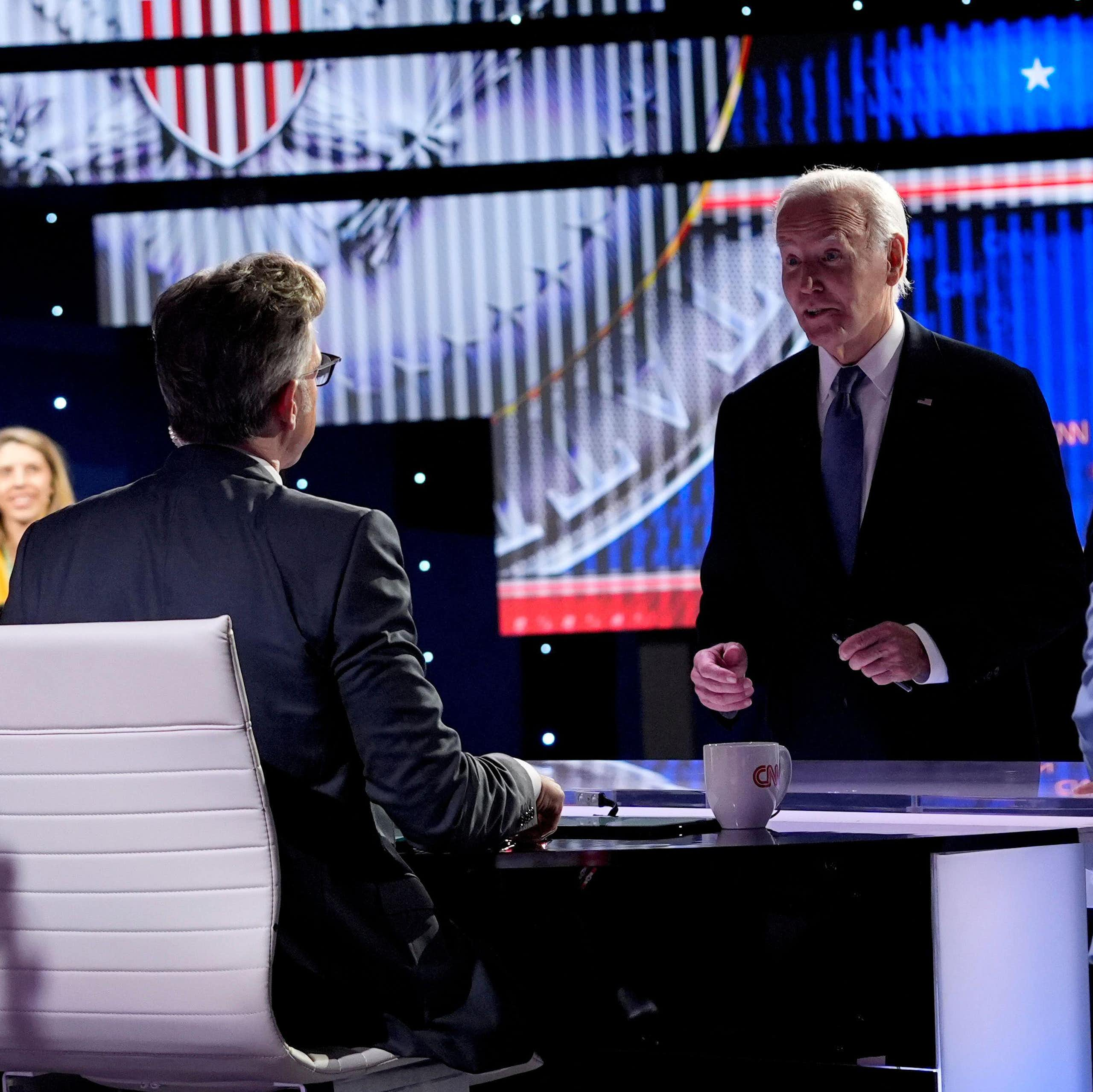 Joe Biden speaks to the host at the TV debate where he clashed with Donald Trump.