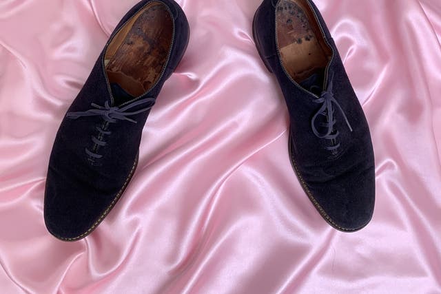 <p>Elvis Presley’s blue suede shoes, pictured, sold for more than $150,000 on Friday </p>