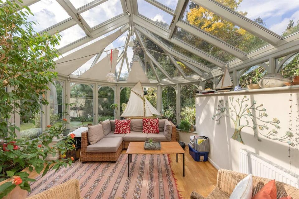 Don't call them conservatories! Homes with chic sun rooms to buy