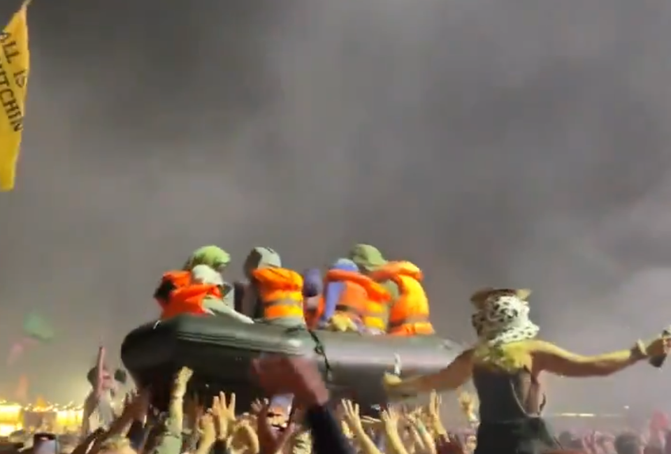 Banksy releases inflatable migrants boat during Glastonbury Idles set